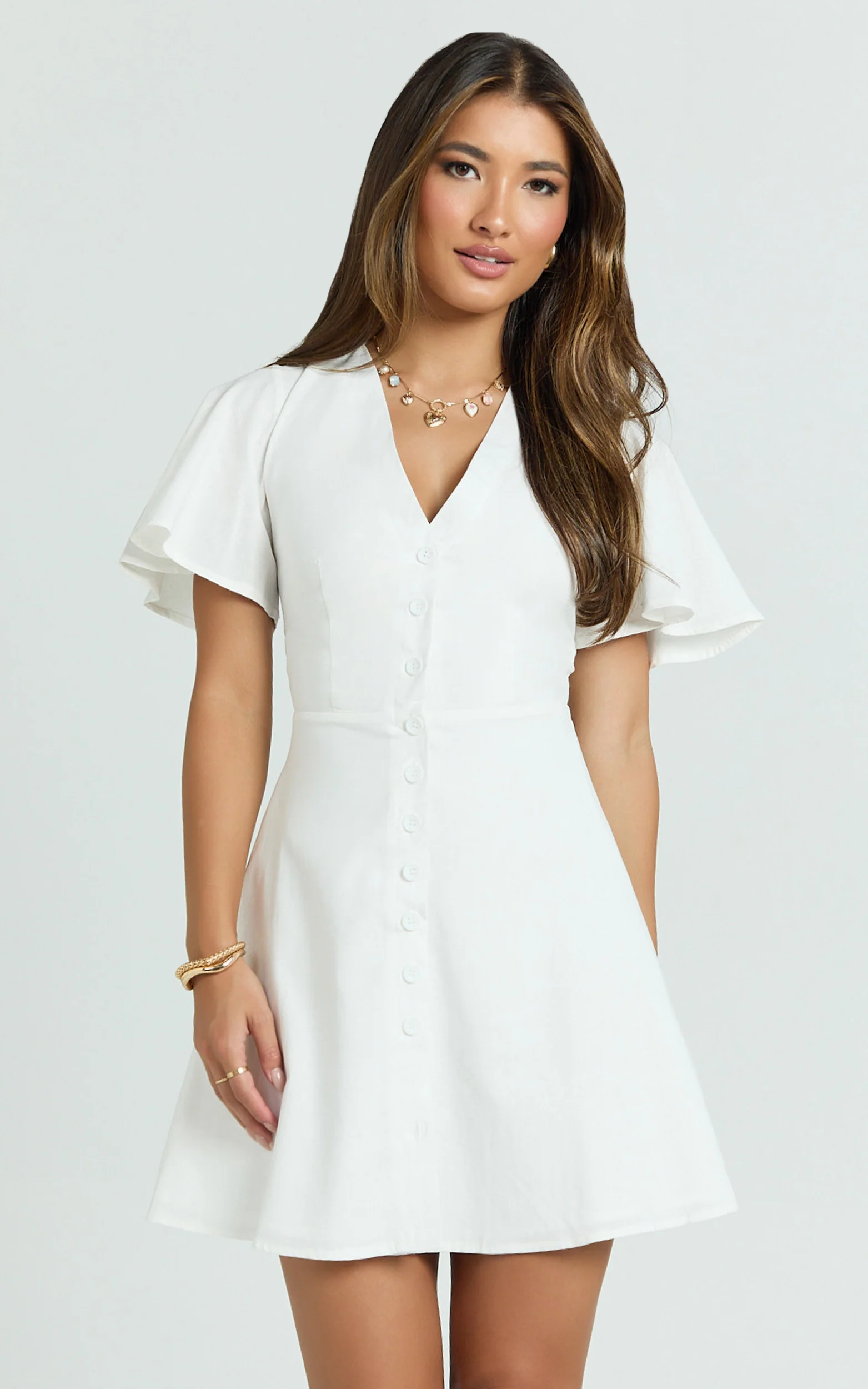 Sahar Mini Dress - Flutter Sleeve Button Through Dress in White - Image 5