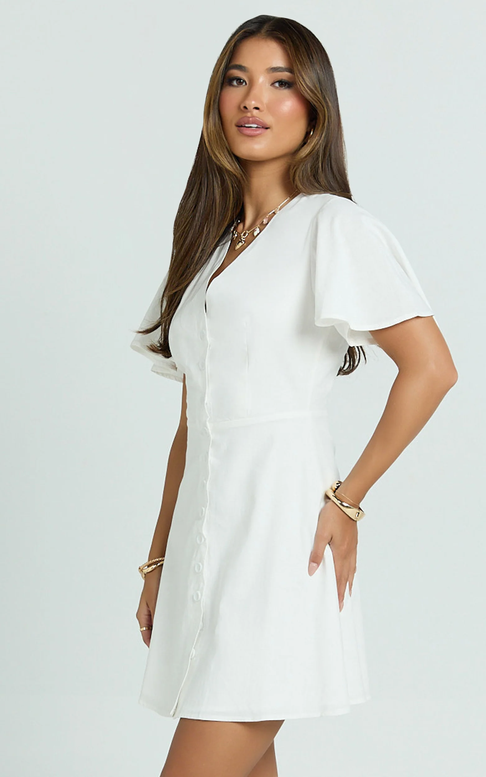 Sahar Mini Dress - Flutter Sleeve Button Through Dress in White - Image 8